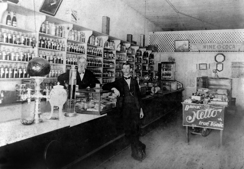 Interior of the Spell Pharmacy, with Dr. Spell on the right.