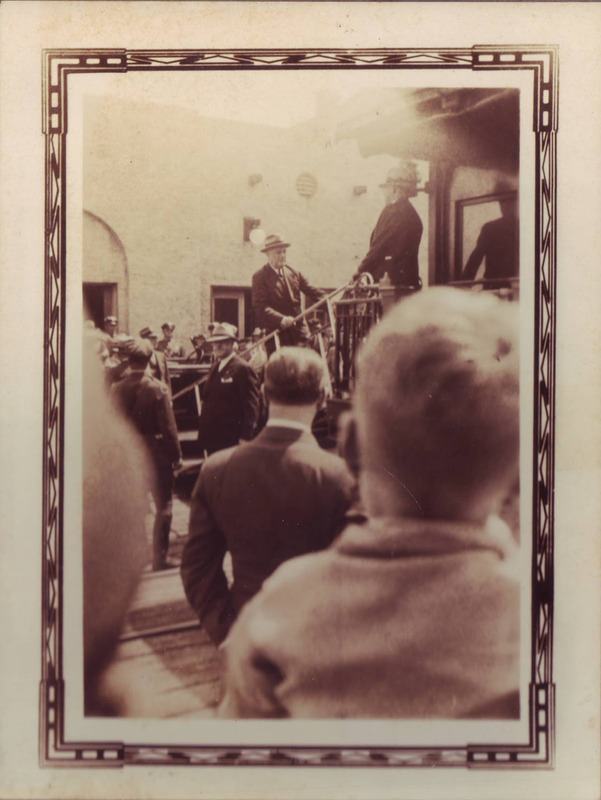 President Franklin Roosevelt boarding the train in Titusville on March 26, 1936. The new station is in the background.