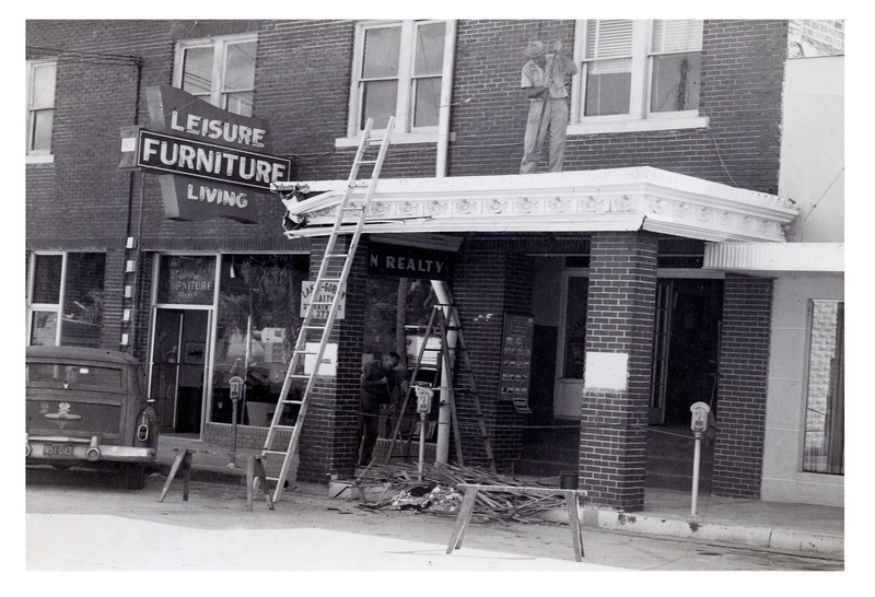 Dismantling the marquee of the Van Croix Theater building in the 1950s. 
