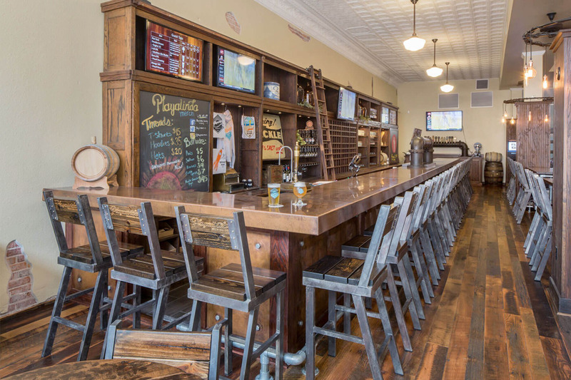 Taproom with original tin ceiling and hardware shelves