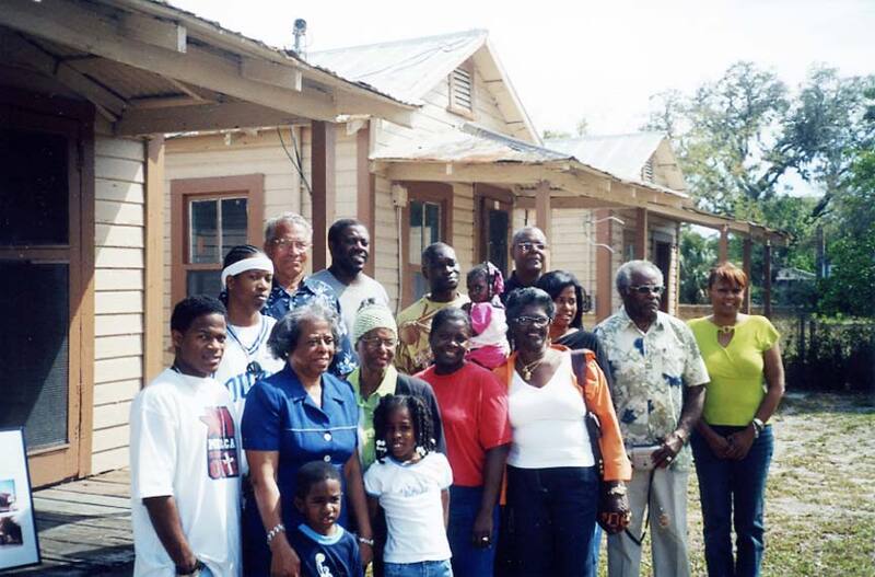 Members of the Gibson Family outside the remaining tenement houses (2006)