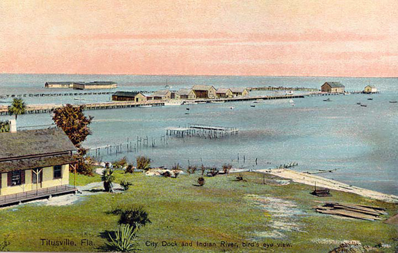 View of the city pier with warehouses and other buildings.